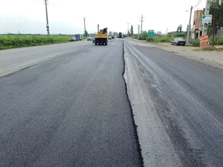 The asphalt wearing course across the full carriageway during the works