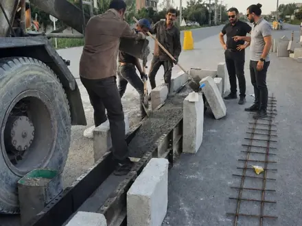 Setting the concrete kerbs during the geometric correction of the axis