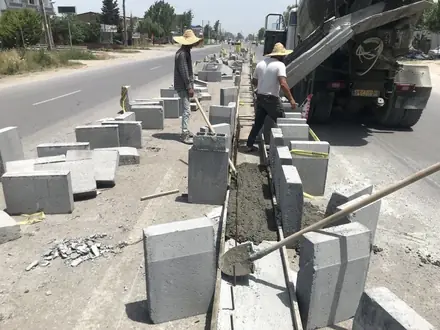 Setting the precast kerb units along the carriageway
