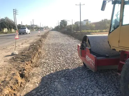 Compacting the sub-base with the road open to traffic